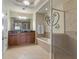 Luxurious bathroom with a double vanity, soaking tub, and walk-in shower with glass enclosure at 1370 Centre Court Ridge Dr # 204, Reunion, FL 34747