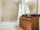Bathroom with brown vanity and tile flooring at 1370 Centre Court Ridge Dr # 204, Reunion, FL 34747