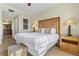 Spacious and well-lit bedroom with a large bed, side tables, and views of the outdoors at 1370 Centre Court Ridge Dr # 204, Reunion, FL 34747