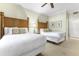 Bedroom with two beds, carpet, and ceiling fan at 1370 Centre Court Ridge Dr # 204, Reunion, FL 34747