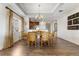 Dining room with light wood floors and decorative chandelier at 1370 Centre Court Ridge Dr # 204, Reunion, FL 34747