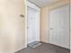 Exterior view of unit door #204 with door mat on a covered floor at 1370 Centre Court Ridge Dr # 204, Reunion, FL 34747
