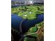 Scenic aerial view showcasing a golf course, water features and sand traps, offering a picturesque golfing experience at 1370 Centre Court Ridge Dr # 204, Reunion, FL 34747