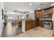 Open kitchen and living room with wood floors, stainless appliances, and modern design at 1370 Centre Court Ridge Dr # 204, Reunion, FL 34747