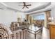 Living room featuring wood floors and glass coffee table at 1370 Centre Court Ridge Dr # 204, Reunion, FL 34747