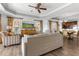 Living room with wood floors and view of kitchen at 1370 Centre Court Ridge Dr # 204, Reunion, FL 34747