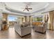 Living room featuring wood floors and ceiling fan at 1370 Centre Court Ridge Dr # 204, Reunion, FL 34747