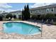 Enjoy the community pool surrounded by lounge chairs and well-maintained landscaping at 141 Mitchell Creek Way, Oviedo, FL 32765