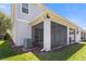 Back exterior view featuring a screened-in patio perfect for outdoor relaxation and entertaining at 141 Mitchell Creek Way, Oviedo, FL 32765