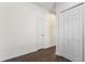 Hallway features wood flooring, neutral walls, and closet with folding doors at 141 Mitchell Creek Way, Oviedo, FL 32765