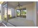 Covered screened patio with sliding glass doors offering seamless indoor-outdoor living and views of the backyard at 141 Mitchell Creek Way, Oviedo, FL 32765