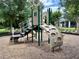 Community playground set on wood chips perfect for outdoor play at 141 Mitchell Creek Way, Oviedo, FL 32765