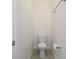 Half bathroom features tile flooring, toilet, and towel rack at 141 Mitchell Creek Way, Oviedo, FL 32765