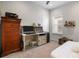 Comfortable bedroom features a desk, ample storage, and a window for natural light at 14131 Lakeview Park Rd, Winter Garden, FL 34787