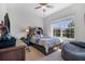 Bedroom with great natural light, a comfortable bed, and ample space for relaxation and personal touches at 14131 Lakeview Park Rd, Winter Garden, FL 34787