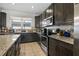 Beautiful kitchen with stainless steel appliances, granite countertops, and ample cabinet space for storage at 14131 Lakeview Park Rd, Winter Garden, FL 34787