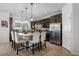 Charming kitchen features granite countertops, stainless steel appliances, and a cozy breakfast bar with seating at 14131 Lakeview Park Rd, Winter Garden, FL 34787