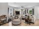Comfortable living room featuring tile floors, large sofa, and neutral colors at 14131 Lakeview Park Rd, Winter Garden, FL 34787