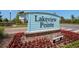 Landmark sign for Lakeview Pointe with flowerbed, and view of the neighborhood beyond at 14131 Lakeview Park Rd, Winter Garden, FL 34787
