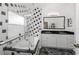 Modern bathroom with black and white tile, soaking tub, and updated vanity at 14208 Morning Frost Dr, Orlando, FL 32828