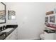 Bathroom with granite counter tops, updated cabinets, and neutral paint at 14208 Morning Frost Dr, Orlando, FL 32828