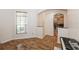 Warm living room with hardwood flooring, natural light from the windows, and open space for entertainment and relaxation at 14208 Morning Frost Dr, Orlando, FL 32828