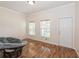 Relaxing lounge area with hardwood floors, abundant natural light, and a papasan chair at 14208 Morning Frost Dr, Orlando, FL 32828