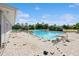 Community pool featuring blue water, tiled decking being updated and other amenities at 14208 Morning Frost Dr, Orlando, FL 32828