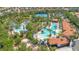 Aerial view of the community pool with lazy river, seating, and recreation areas at 1504 Oak Marsh Loop, Davenport, FL 33837