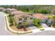 Beautiful two-story home with manicured landscaping, a tile roof, and a paver driveway at 1504 Oak Marsh Loop, Davenport, FL 33837