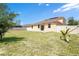 Sprawling backyard is fully fenced and ready for outdoor games or a relaxing lounge area at 1504 Oak Marsh Loop, Davenport, FL 33837