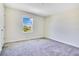 Bedroom with neutral carpet, white walls and a window at 1504 Oak Marsh Loop, Davenport, FL 33837