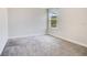 Bedroom with neutral carpet, a window and electrical outlets at 1504 Oak Marsh Loop, Davenport, FL 33837