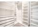 The walk-in closet provides ample storage space with shelving and drawers for organization at 1504 Oak Marsh Loop, Davenport, FL 33837