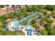 Relaxing lazy river and lounge chairs surrounded by beautiful tropical landscaping and trees at 1504 Oak Marsh Loop, Davenport, FL 33837