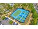 Aerial view of tennis and pickleball courts available in the community, with ample parking at 1504 Oak Marsh Loop, Davenport, FL 33837