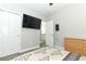 Bedroom with TV, dresser and view into the bathroom at 15849 Sweet Lemon Way, Winter Garden, FL 34787