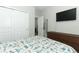 Bedroom with TV, dresser and closet at 15849 Sweet Lemon Way, Winter Garden, FL 34787