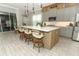 Spacious kitchen with a large island, modern cabinets, and stainless-steel appliances at 15849 Sweet Lemon Way, Winter Garden, FL 34787