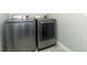 Laundry room with front loading Samsung washer and dryer at 15849 Sweet Lemon Way, Winter Garden, FL 34787