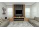 Cozy living room featuring comfortable seating, modern fireplace, and elegant decor at 15849 Sweet Lemon Way, Winter Garden, FL 34787