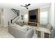 Modern living room with plush sofas, stylish decor, and a large television at 15849 Sweet Lemon Way, Winter Garden, FL 34787
