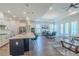 Bright, open-concept kitchen with a large island, stainless steel appliances, and adjacent dining area at 1598 Whitewood Ct, Kissimmee, FL 34747