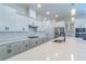 Well-equipped kitchen with white cabinets, subway tile backsplash, and gas cooktop at 1598 Whitewood Ct, Kissimmee, FL 34747