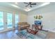 Comfortable living room with wood floors, neutral decor, and a ceiling fan at 1598 Whitewood Ct, Kissimmee, FL 34747