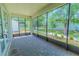Spacious screened patio with brick floors and serene outdoor views at 1598 Whitewood Ct, Kissimmee, FL 34747