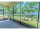 Bright screened patio overlooking a lush backyard and mature landscaping at 1598 Whitewood Ct, Kissimmee, FL 34747