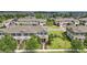 Areal view of well maintained townhome community with mature trees at 16163 Pebble Bluff Loop, Winter Garden, FL 34787