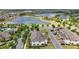A bird's eye view reveals a community dotted with homes, ponds, and lush greenery at 16163 Pebble Bluff Loop, Winter Garden, FL 34787