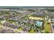 Overhead view of a new community with an inviting pool and clubhouse amidst homes at 16163 Pebble Bluff Loop, Winter Garden, FL 34787